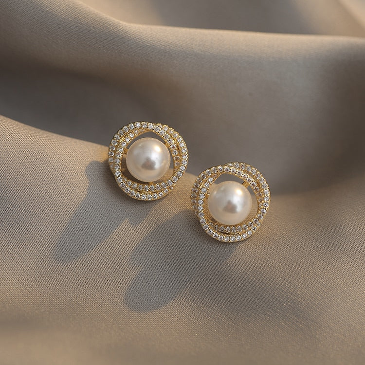 Geometric whirlpool shape pearl Earrings